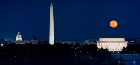 A panorama shows the March 19 2011 supermoon hanging over the monuments of Washington DC