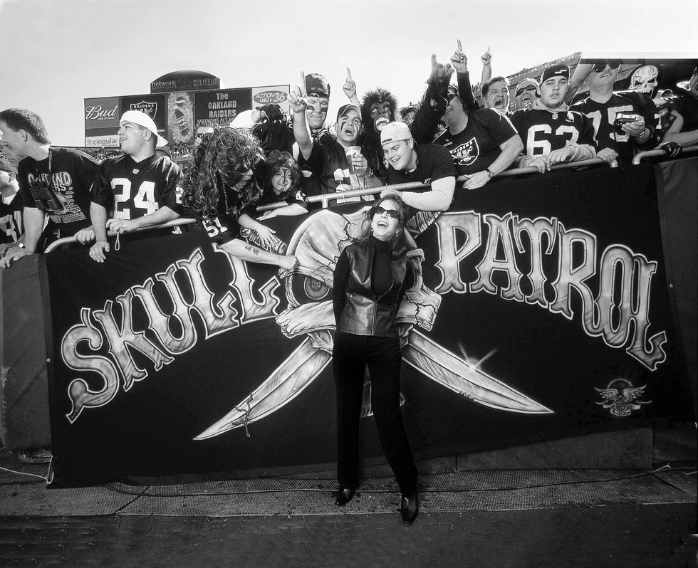 Amy Trask, Chief Executive of the Oakland Raiders, watches the team and  talks with fans and com …