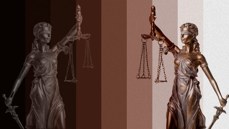 symbol of justice represented by a statue holding scales and a sword