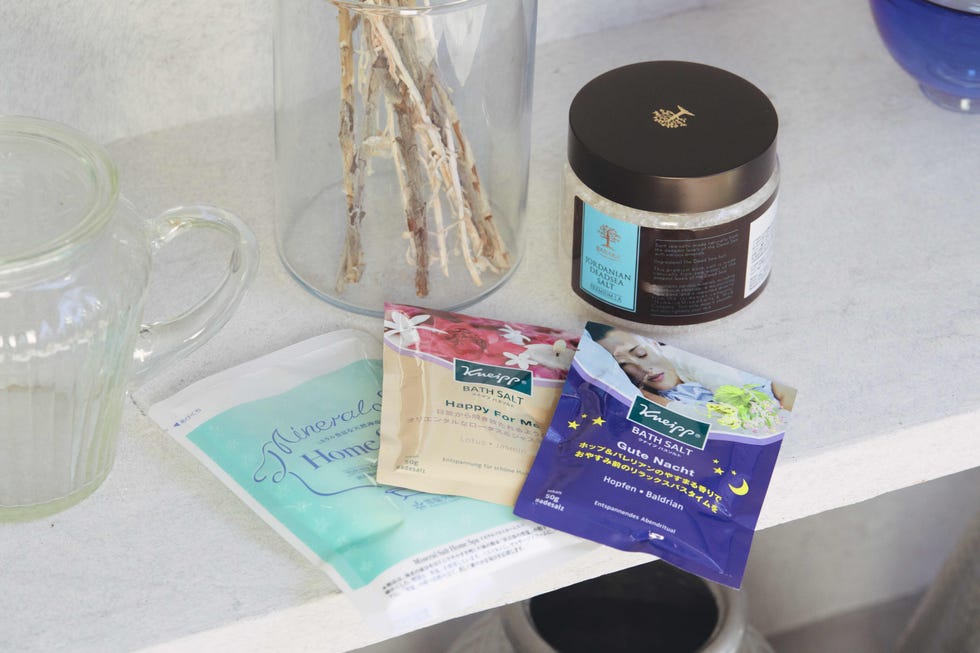 a table with a jar of spread and a box of chocolates