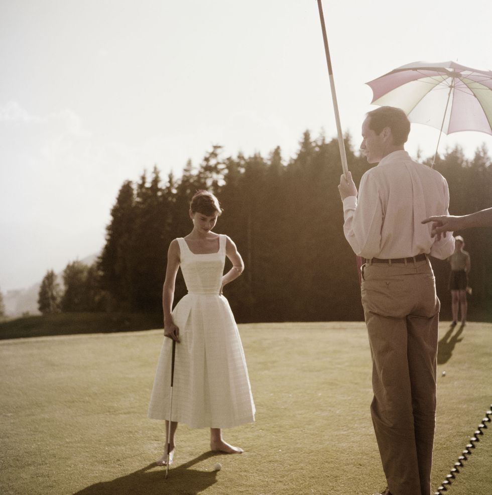 Hepburn And Ferrer Play Golf