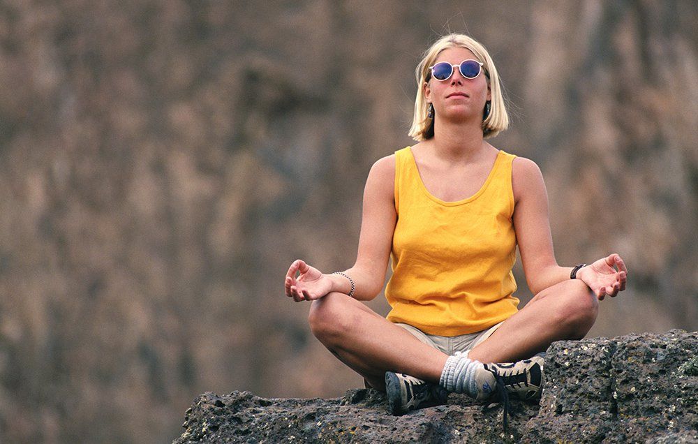 woman meditating outdoors