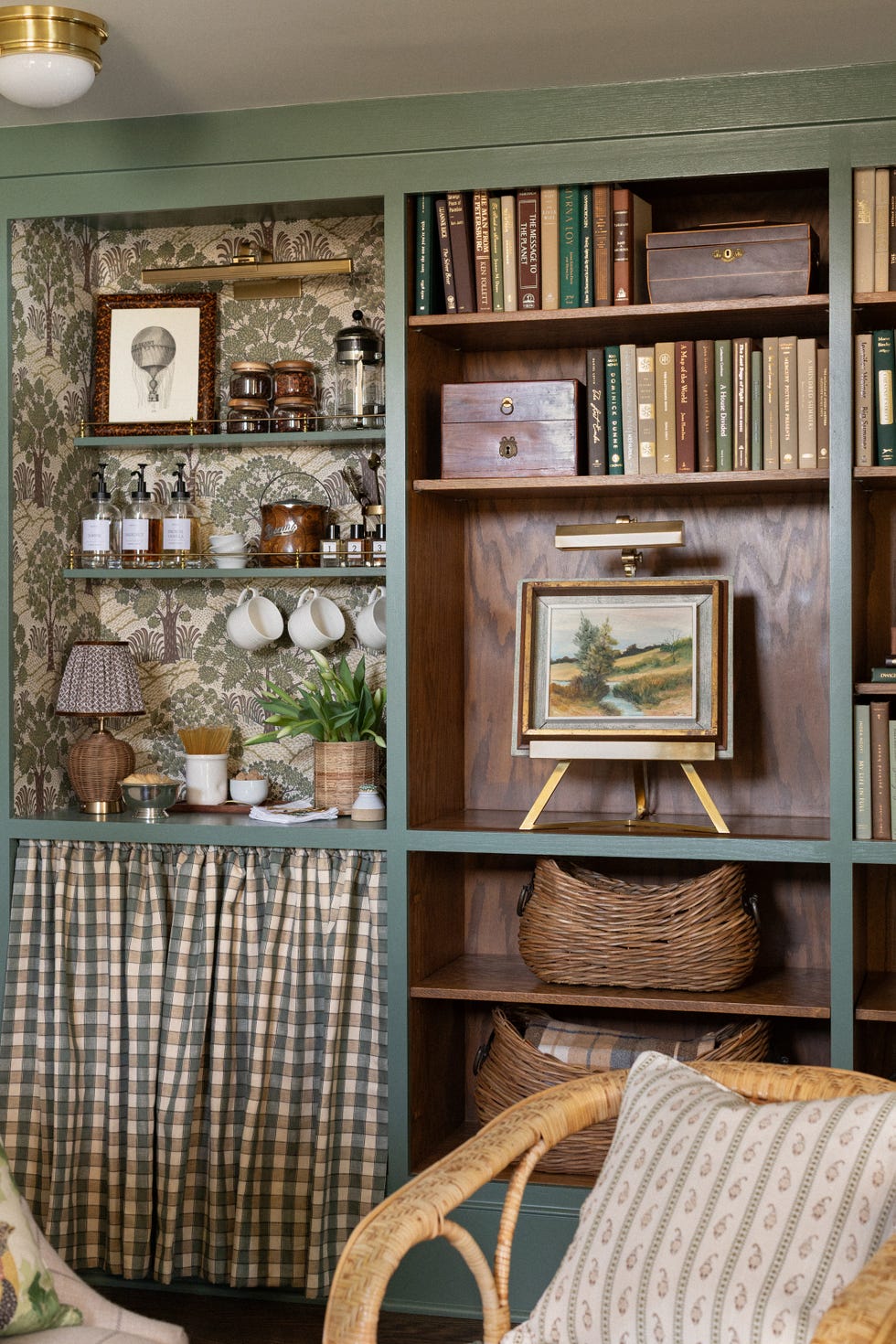sage green bookshelves and with tea area