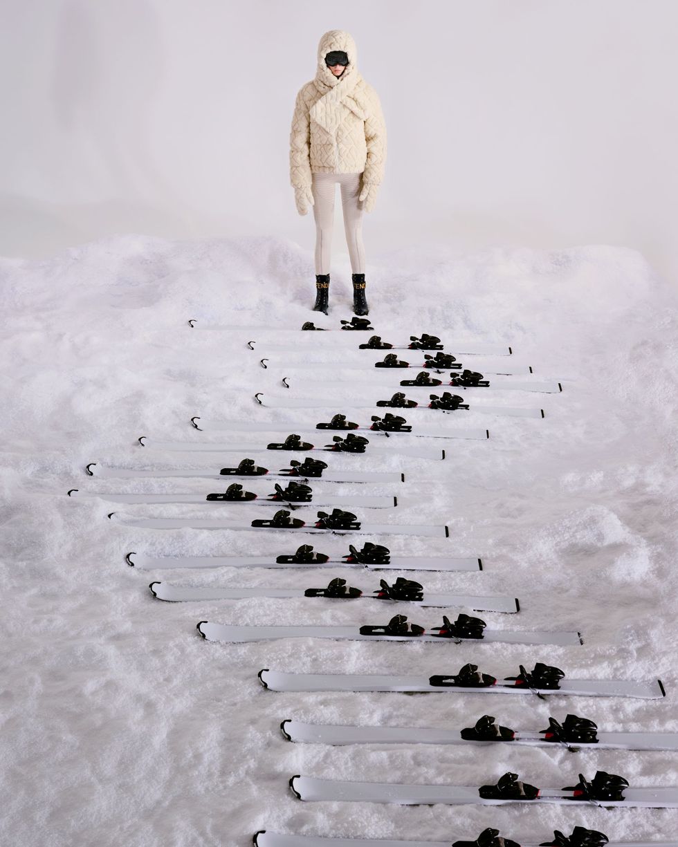 a person standing on a pile of black birds
