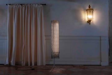 a floor light with a chainmail shade