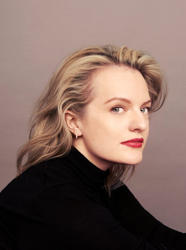 profile view of a person with styled blonde hair and wearing a black turtleneck