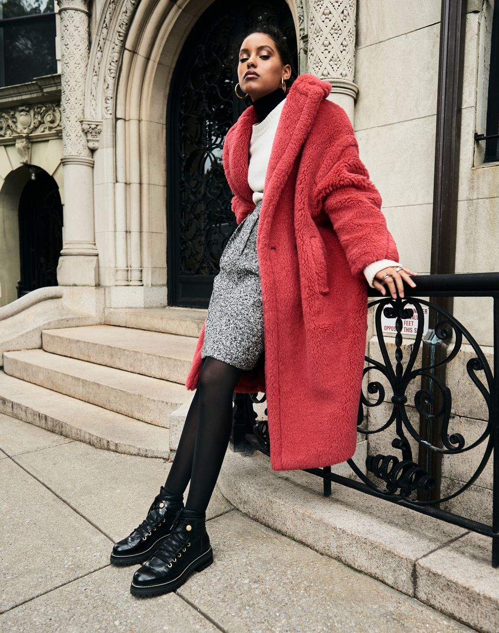 A model in a red fur coat