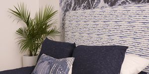 Wall, Furniture, Property, Room, Cushion, Tree, Grass, Bedding, Textile, Plant, 