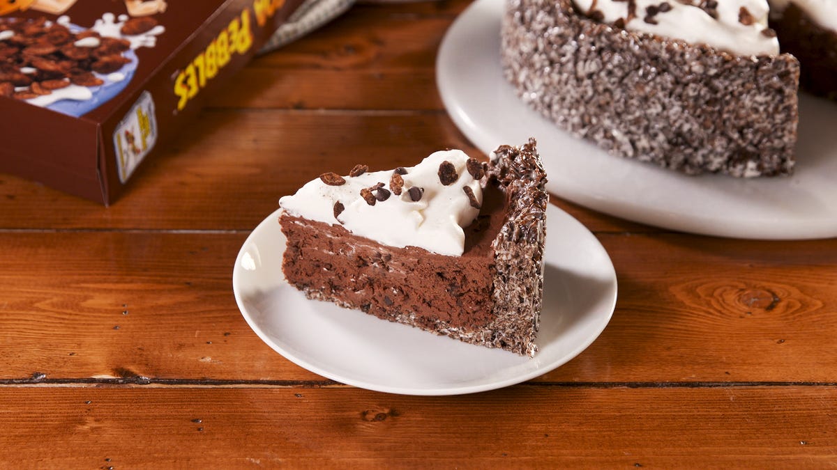 preview for Cocoa PEBBLES™-Crusted No-Bake Cheesecake I Delish + PEBBLES