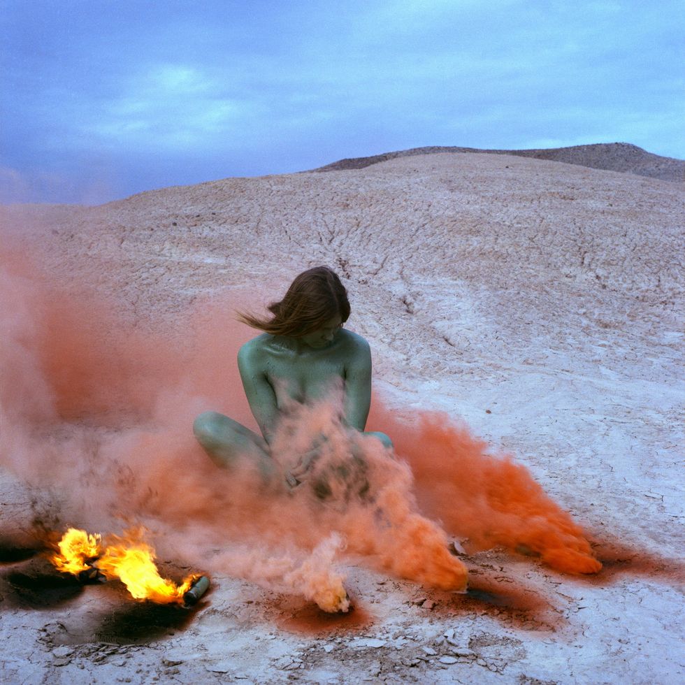 judy chicago, immolation from women and smoke, 1972, fireworks performance, performed by faith wilding in the california desert
