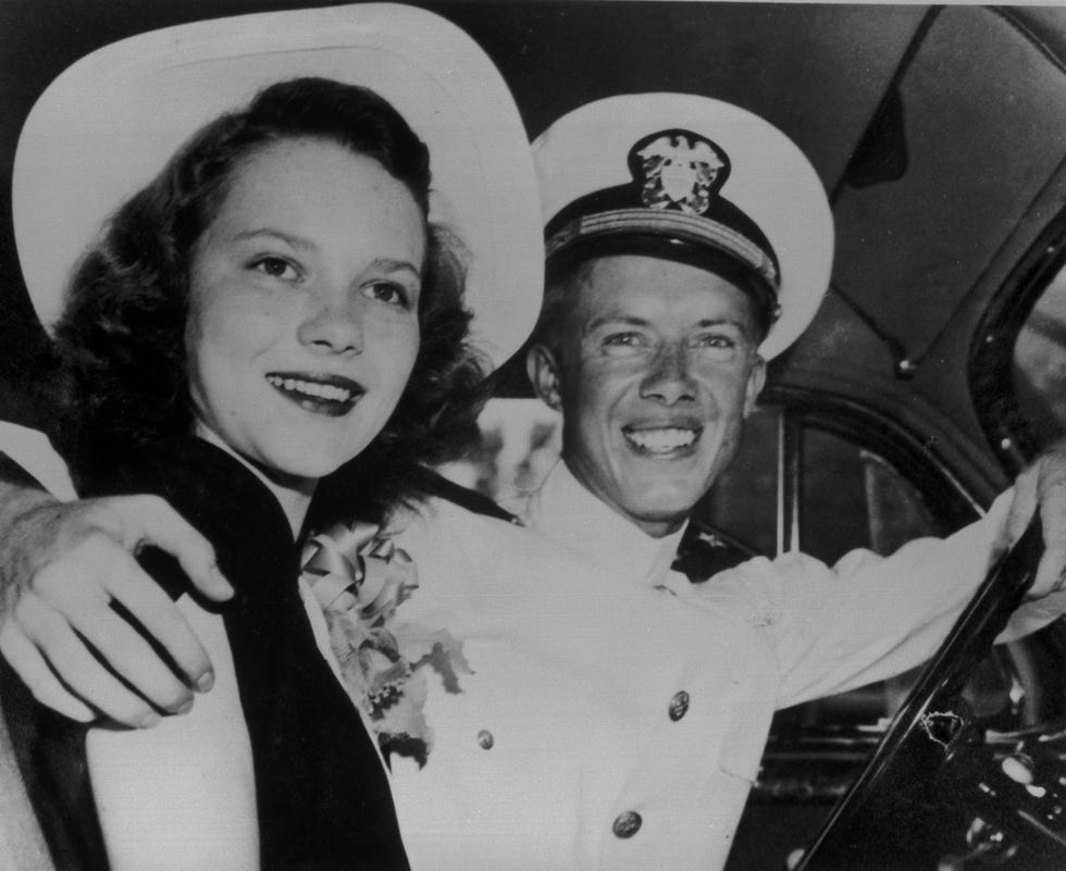 a man and woman posing for a picture