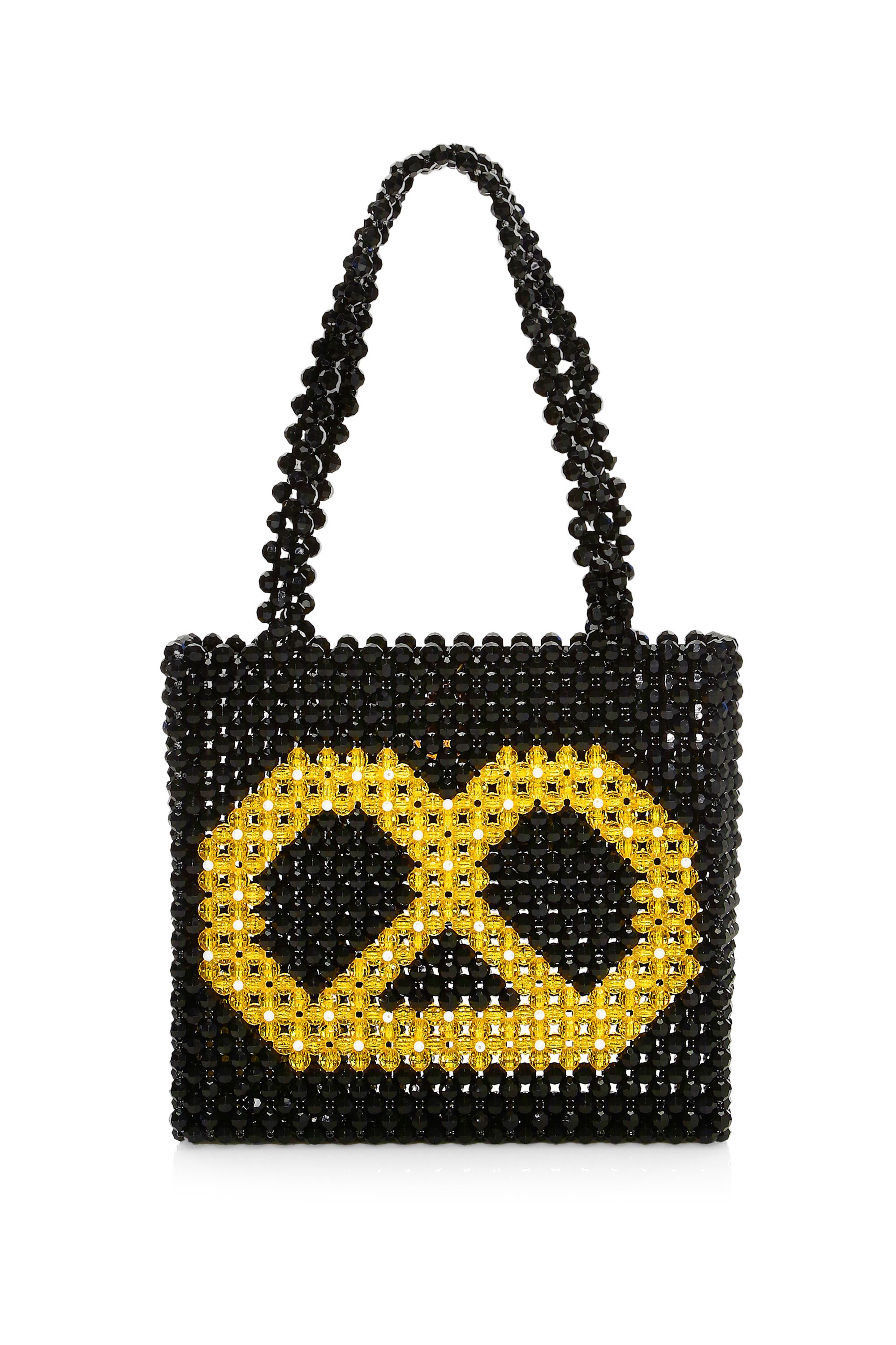 Handbag, Bag, Black, Yellow, Fashion accessory, Shoulder bag, Tote bag, Design, Material property, Font, 