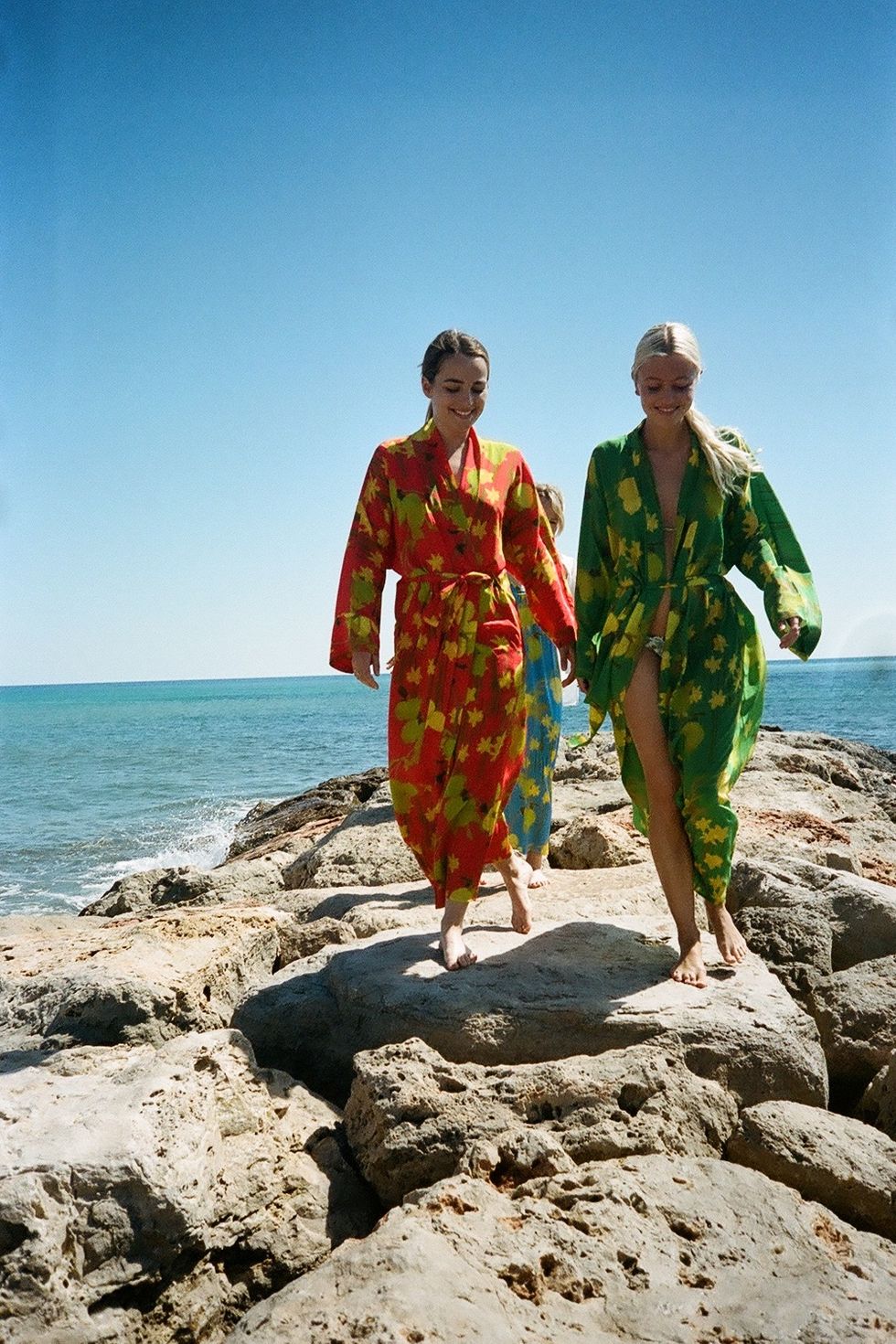 two women wearing robes