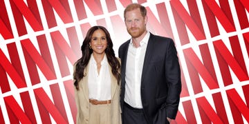 Couple posing in front of a Netflix-themed background.
