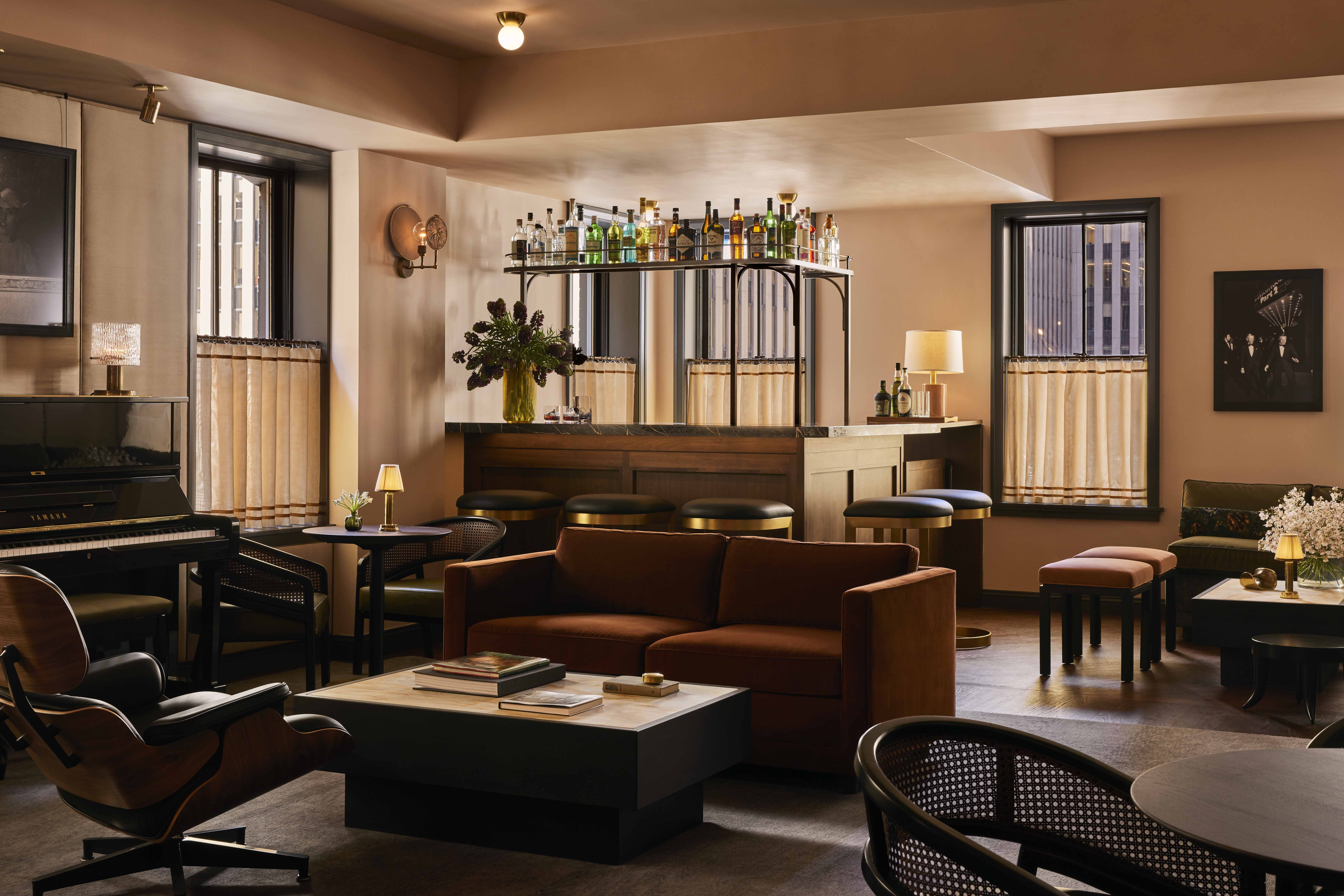 A List 2022 - ELLE DECOR interior with small seating arrangements in dark tones