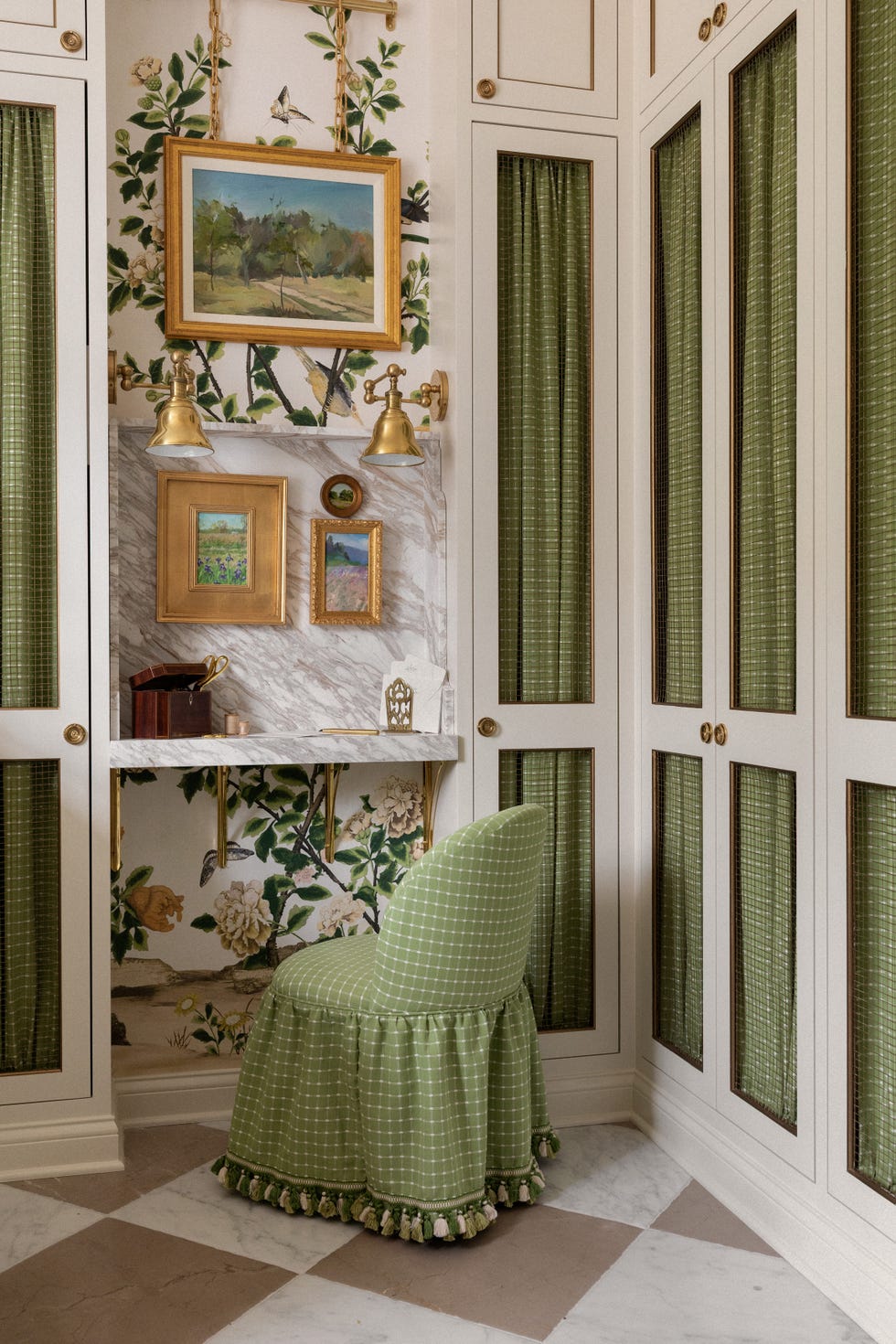 green slipper chair at a small desk in a white laundry room