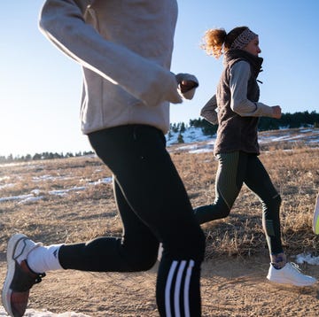 Group of runners on a dirt path in a natural setting group of runners on a dirt path in a natural setting