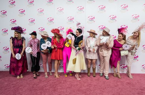 cassie livingston, far left, of monroe, la, reacts after winning the longines kentucky oaks prize for elegance fashion contest, friday, may 6, 2022, at churchill downs in louisville, ky  longines, the swiss watch manufacturer known for its luxury timepieces, is the official watch and timekeeper of the 148th kentucky derby diane bondareffap images for longines