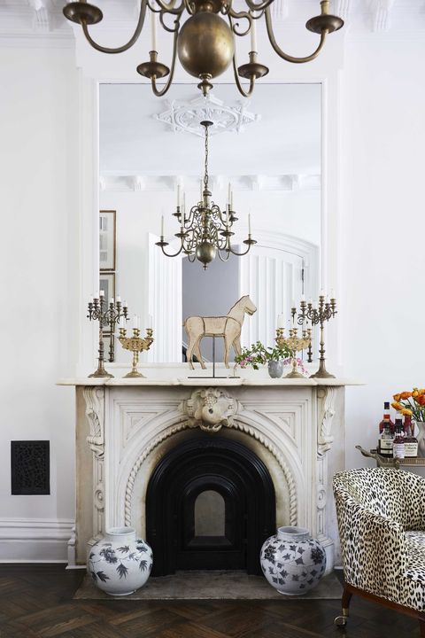 fireplace, leopard chair, decorative mantle, horse sculpture
