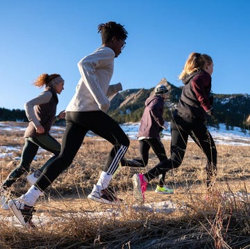 Group of runners training outdoors in a natural landscape group of runners training outdoors in a natural landscape