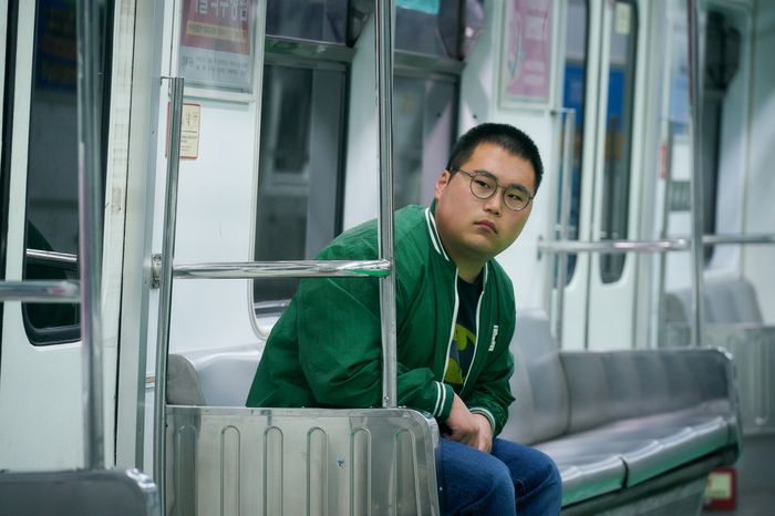 a man sitting on a bus