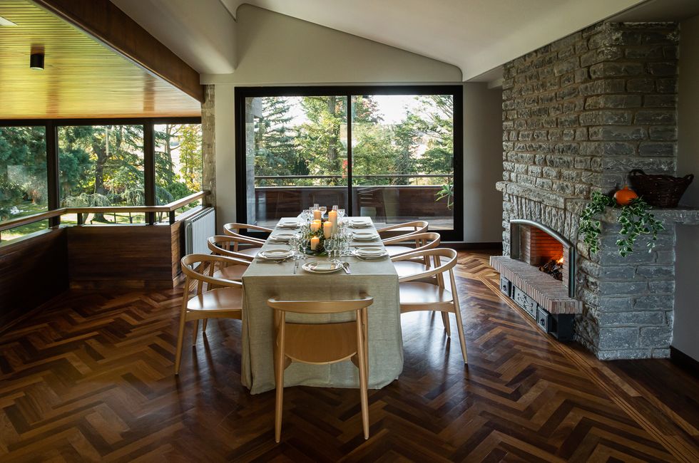 a dining room table with a fireplace