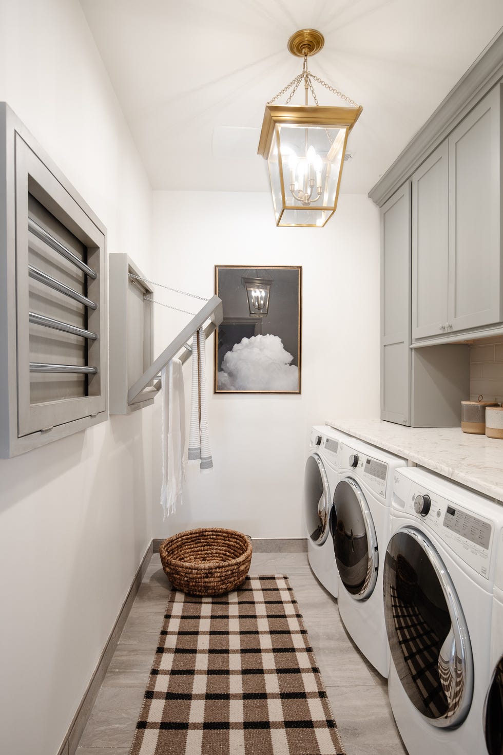 laundry room with wall mounted drying rack