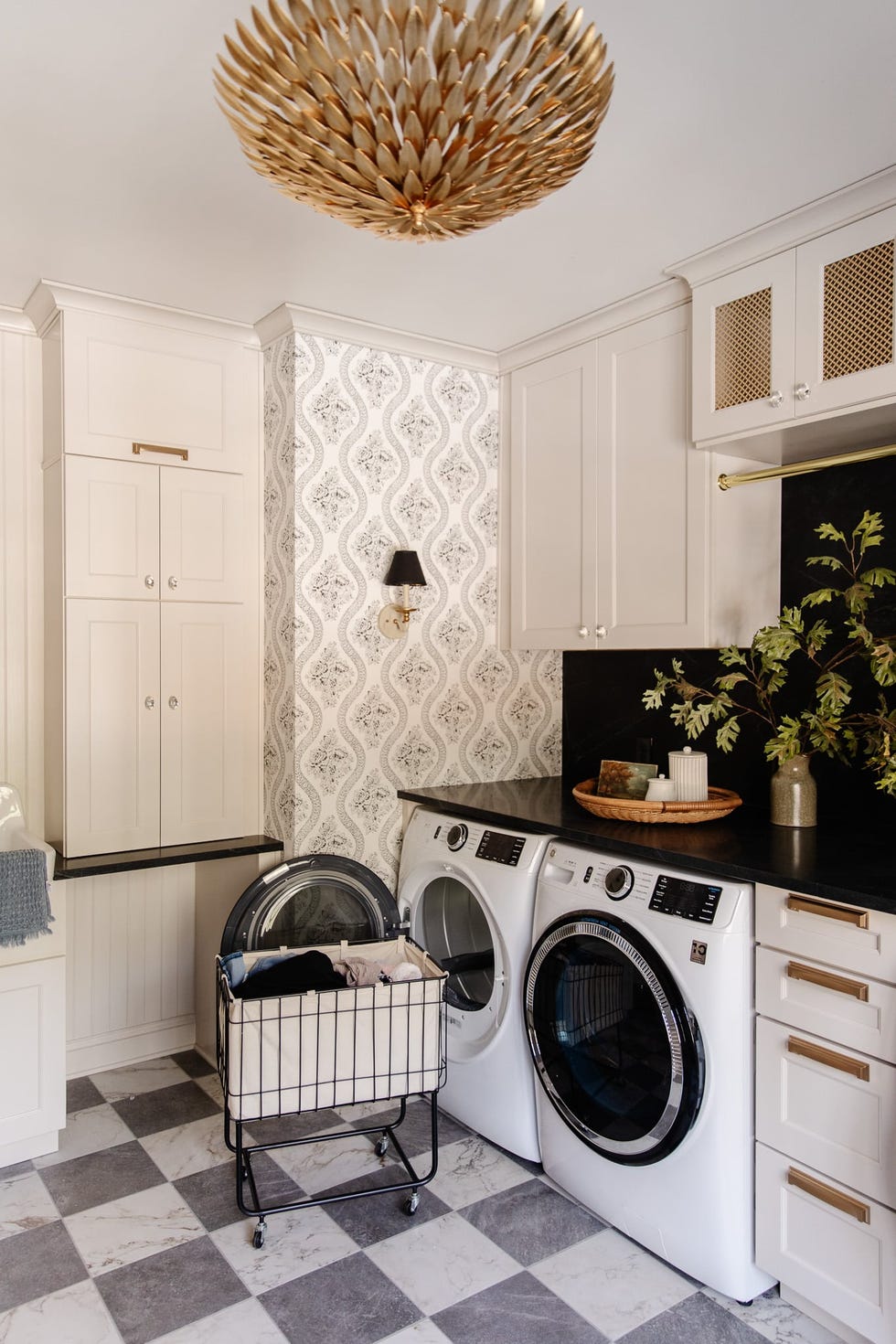 decorated laundry room with rolling hamper