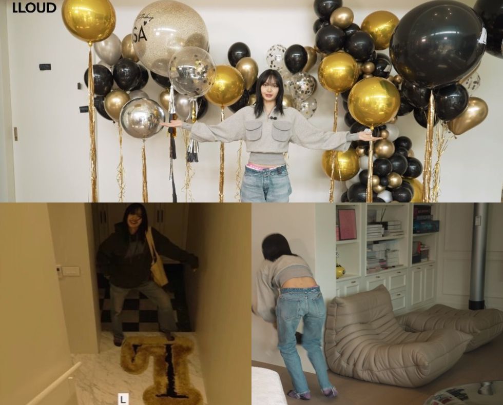 a person holding a bunch of balloons