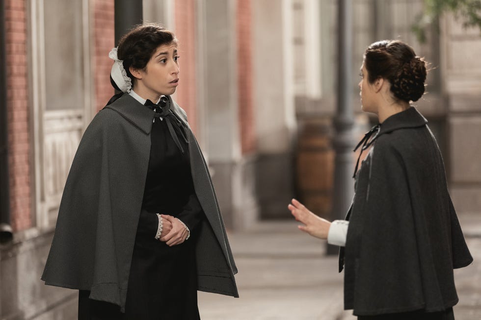 Outerwear, Fashion, Costume, Street fashion, Cape, Cloak, Gesture, Conversation, Scene, 