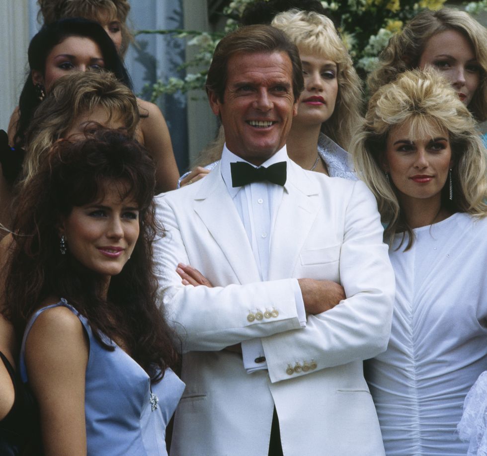 english actor roger moore and the james bond girls for the presentation of the film a view to kill photo by jerome preboiskipasygma via getty images