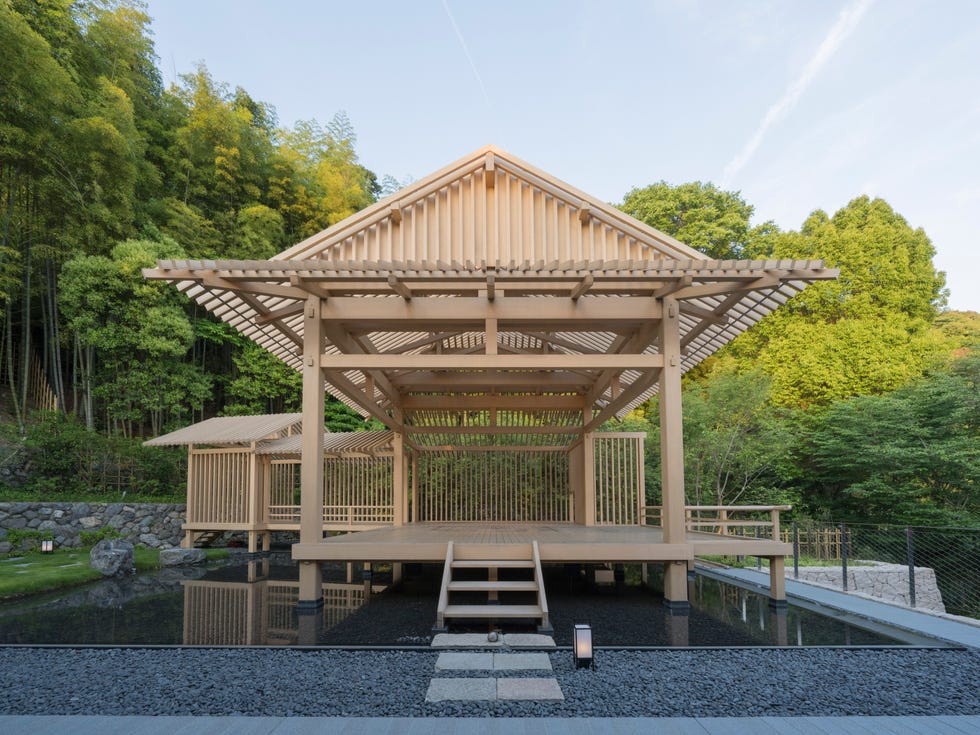 japanesestyle wooden structure surrounded by greenery