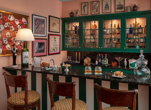 home bar pink wall green cabinet