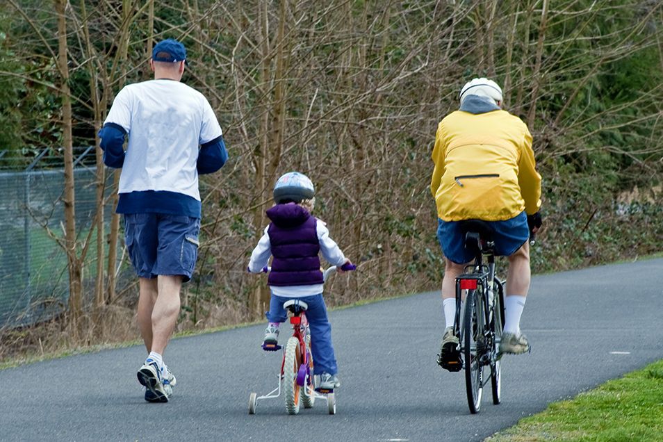 Grandfather, father and child out for exercise