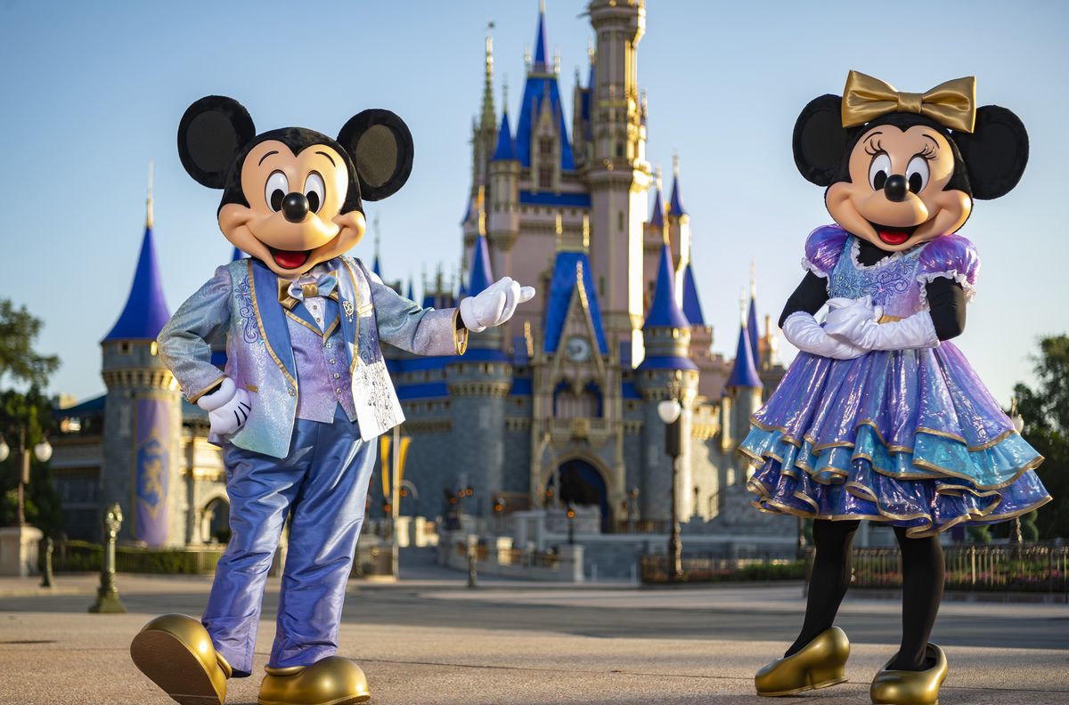 beginning oct 1, 2021, mickey mouse and minnie mouse will host “the world’s most magical celebration” honoring walt disney world resort’s 50th anniversary in lake buena vista, fla they will dress in sparkling new looks custom made for the 18 month event, highlighted by embroidered impressions of cinderella castle on multi toned, earidescent fabric punctuated with pops of gold matt stroshane, photographer
