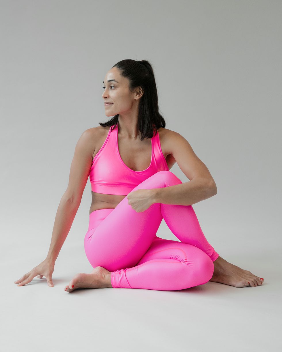 Sportswear, Pink, Sitting, Clothing, Shoulder, Physical fitness, Leg, Thigh, Arm, Joint, 
