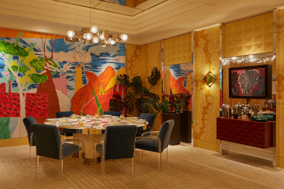 Colorful dining room with modern decor and artwork.