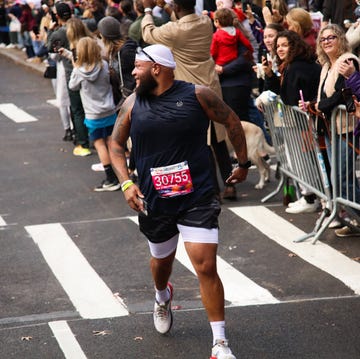 a person walking in a race a person walking in a race