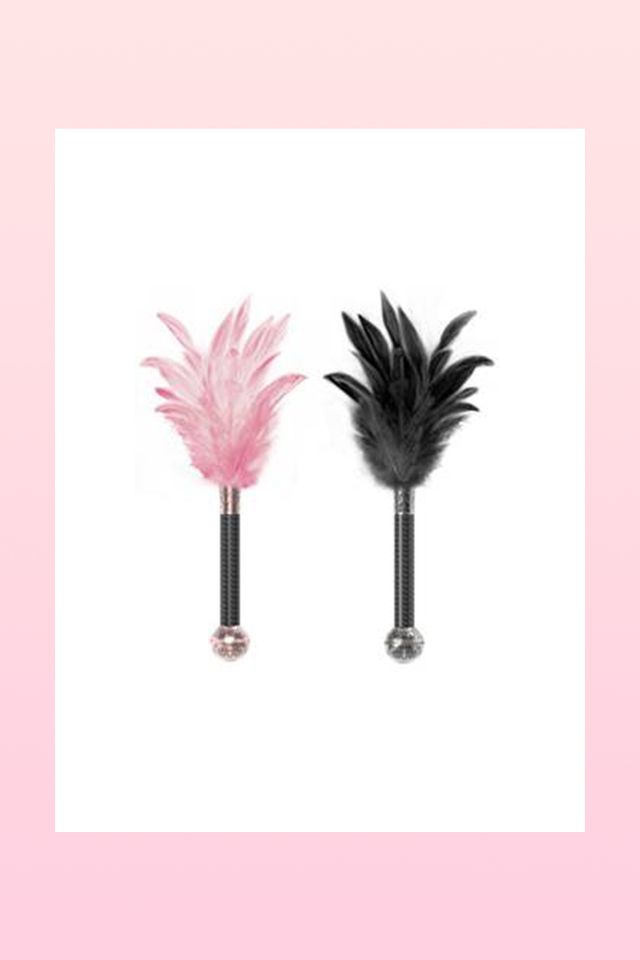 Pink, Feather, Plant, Quill, Tree, Fashion accessory, Pen, Writing implement, Costume, Palm tree, 