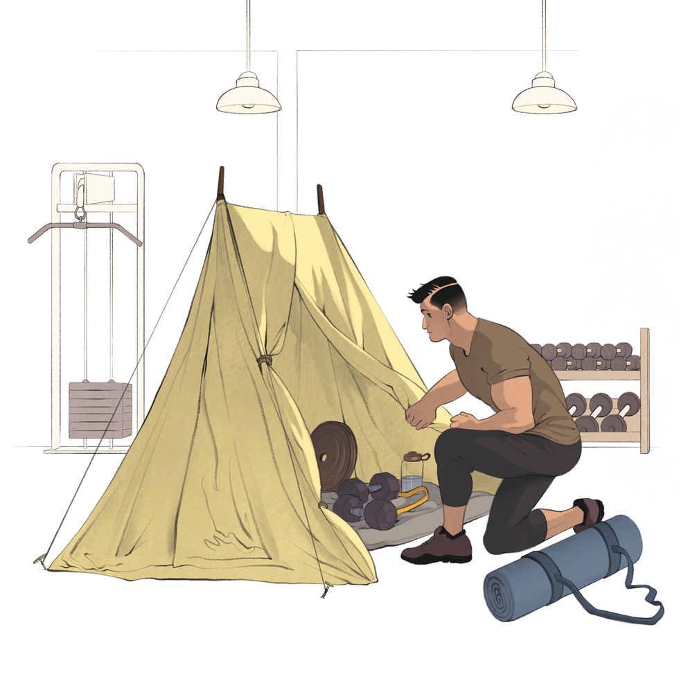 a man sitting on a tent