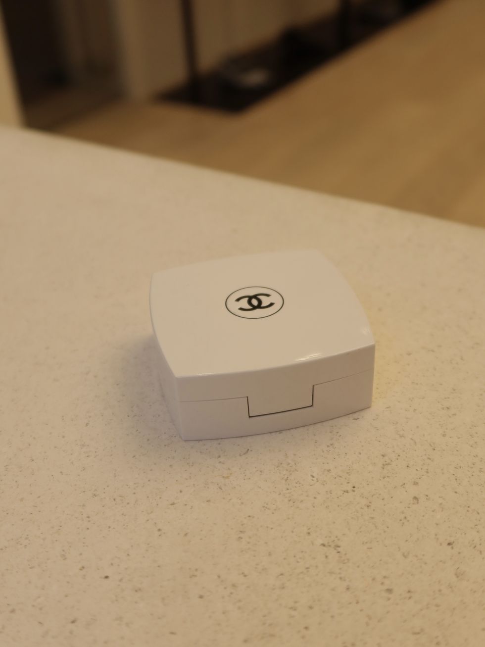 a white square object with a logo on it