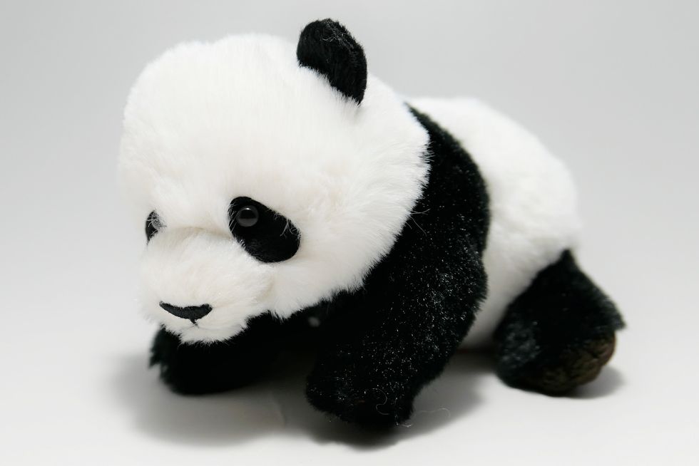 a black and white stuffed animal