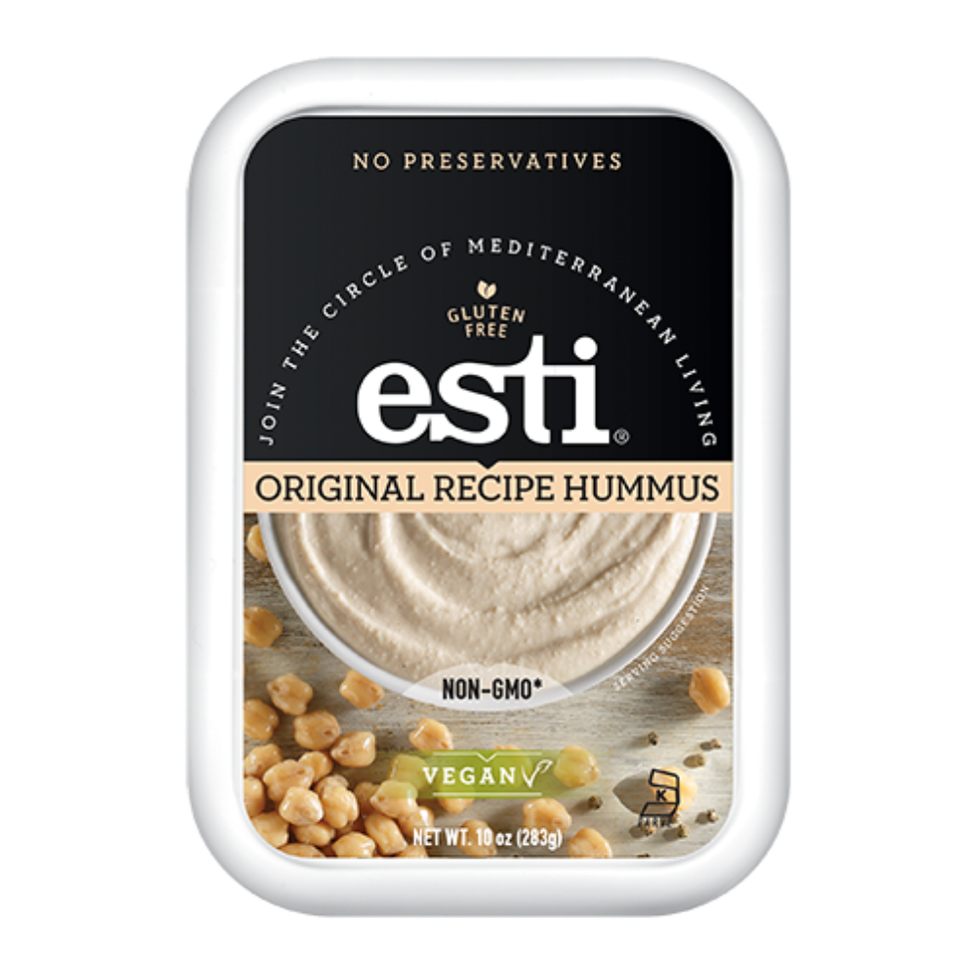 a plastic container featuring a creamy hummus spread with a light tan color