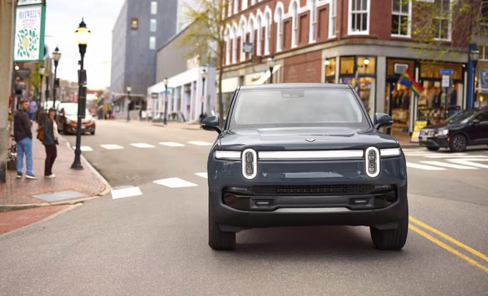 electric vehicle driving on a city street
