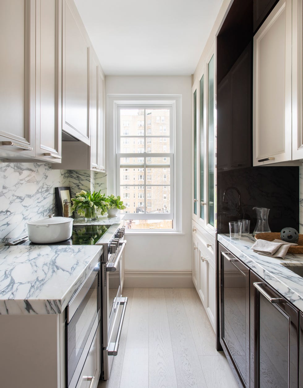 modern galley kitchen with marble countertops