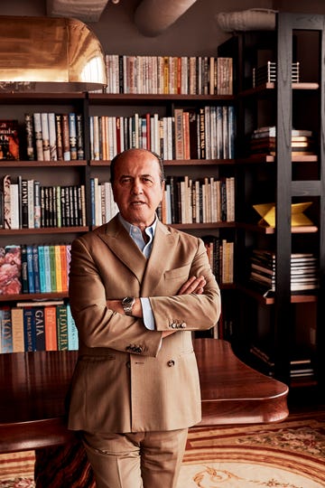 a person standing in front of a book shelf