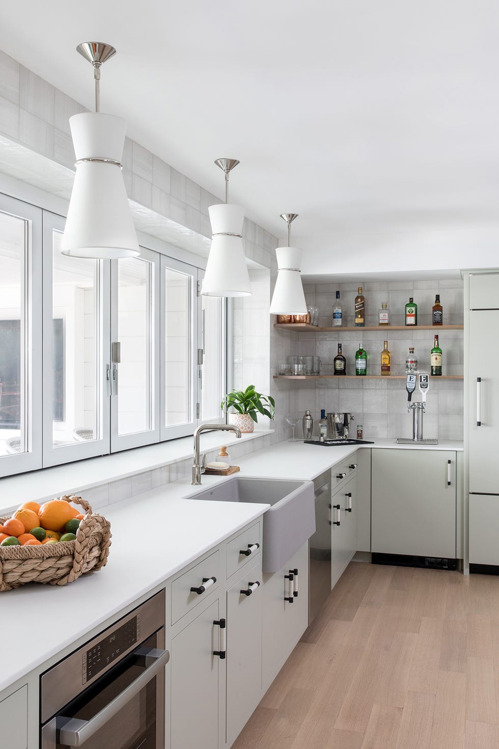 a kitchen with white cabinets and white ceiling