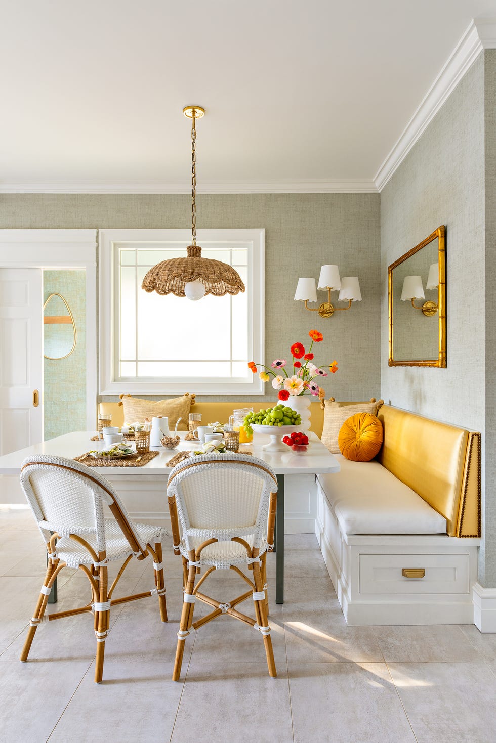a breakfast nook in a kitchen with heated flooring by interior designer rob stuart