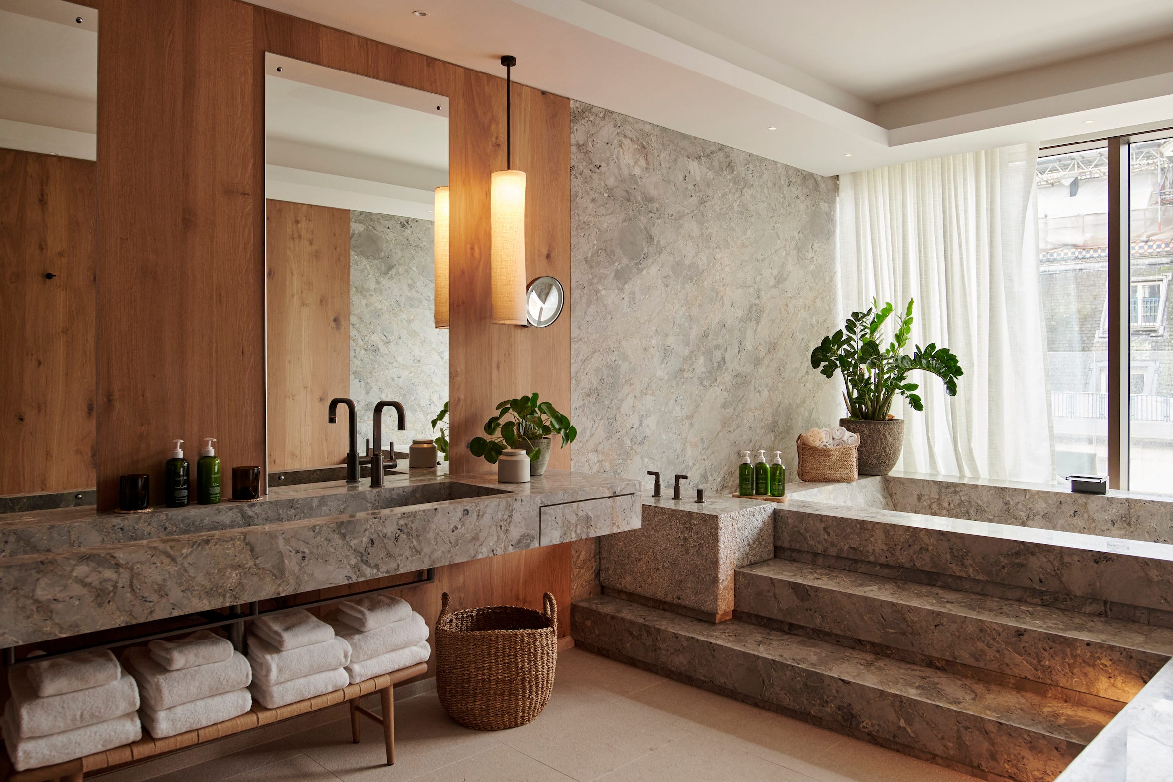 a bathroom with a large marble countertop
