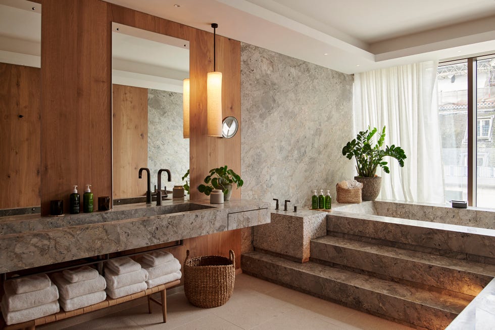 a bathroom with a large marble countertop
